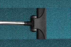 Vacuuming carpet tiles