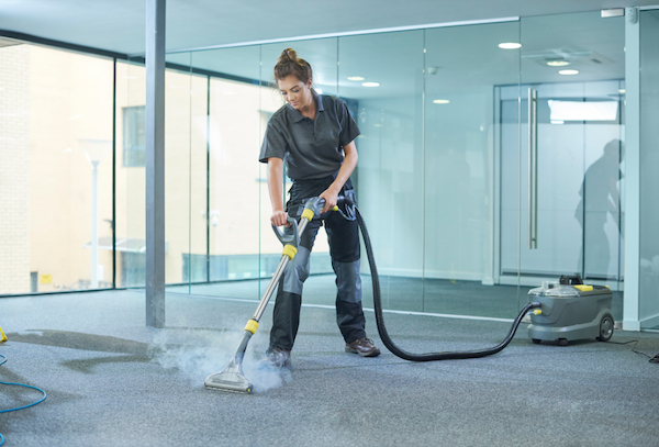 A woman cleaning carpets